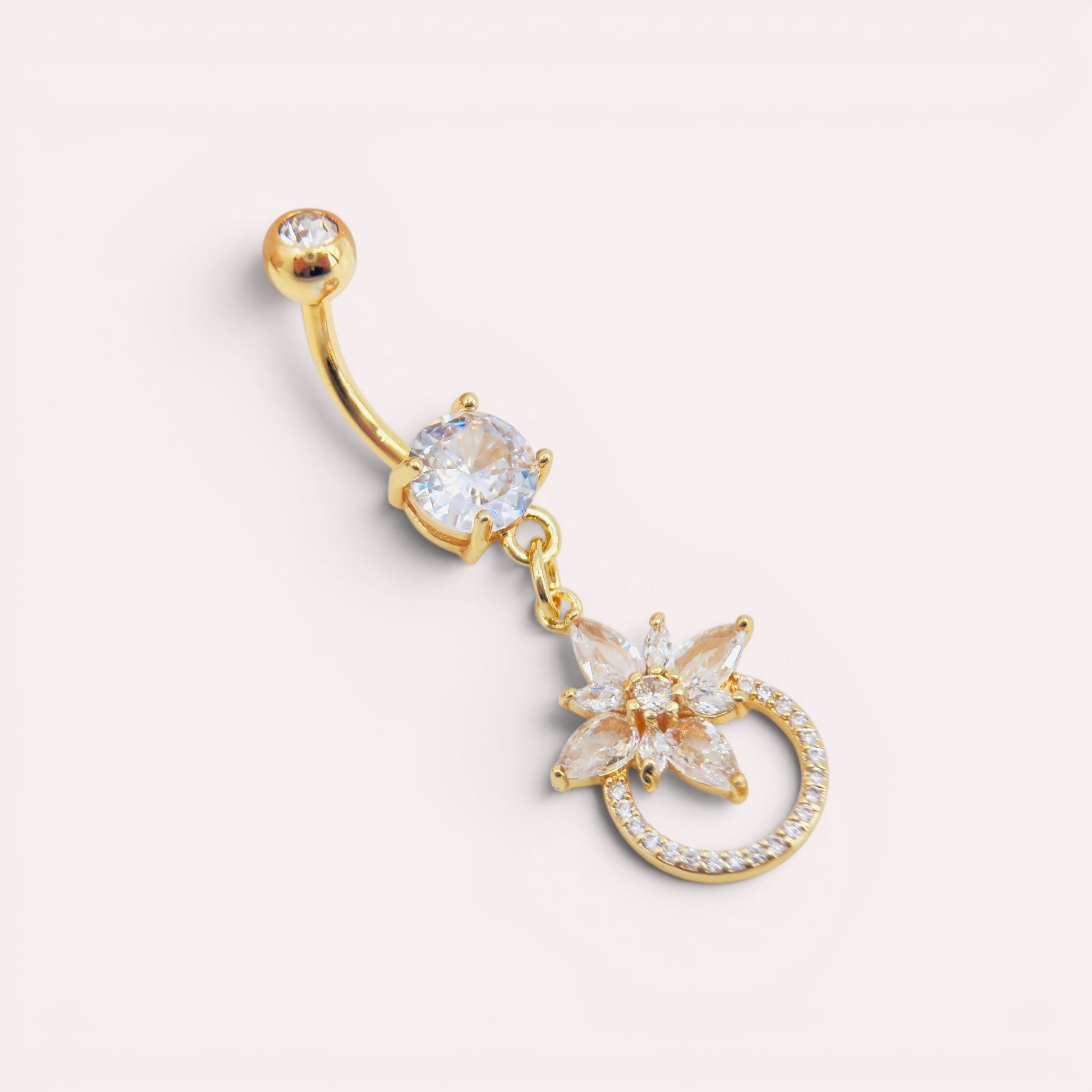 MKBodyJewelry 14g gold surgical steel belly button ring featuring a dangling floral charm with sparkling CZ stones.