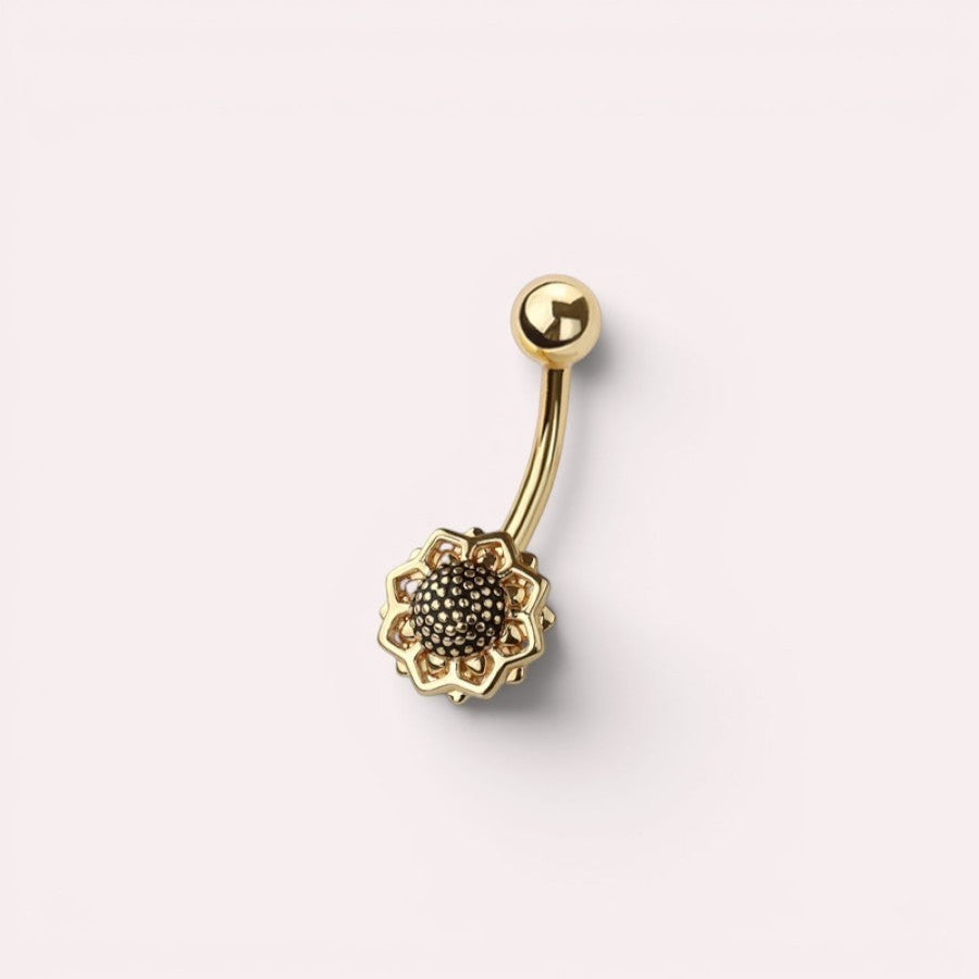 MKBodyJewelry 14G gold floral belly ring made of surgical steel with a dainty flower design for navel piercings.
