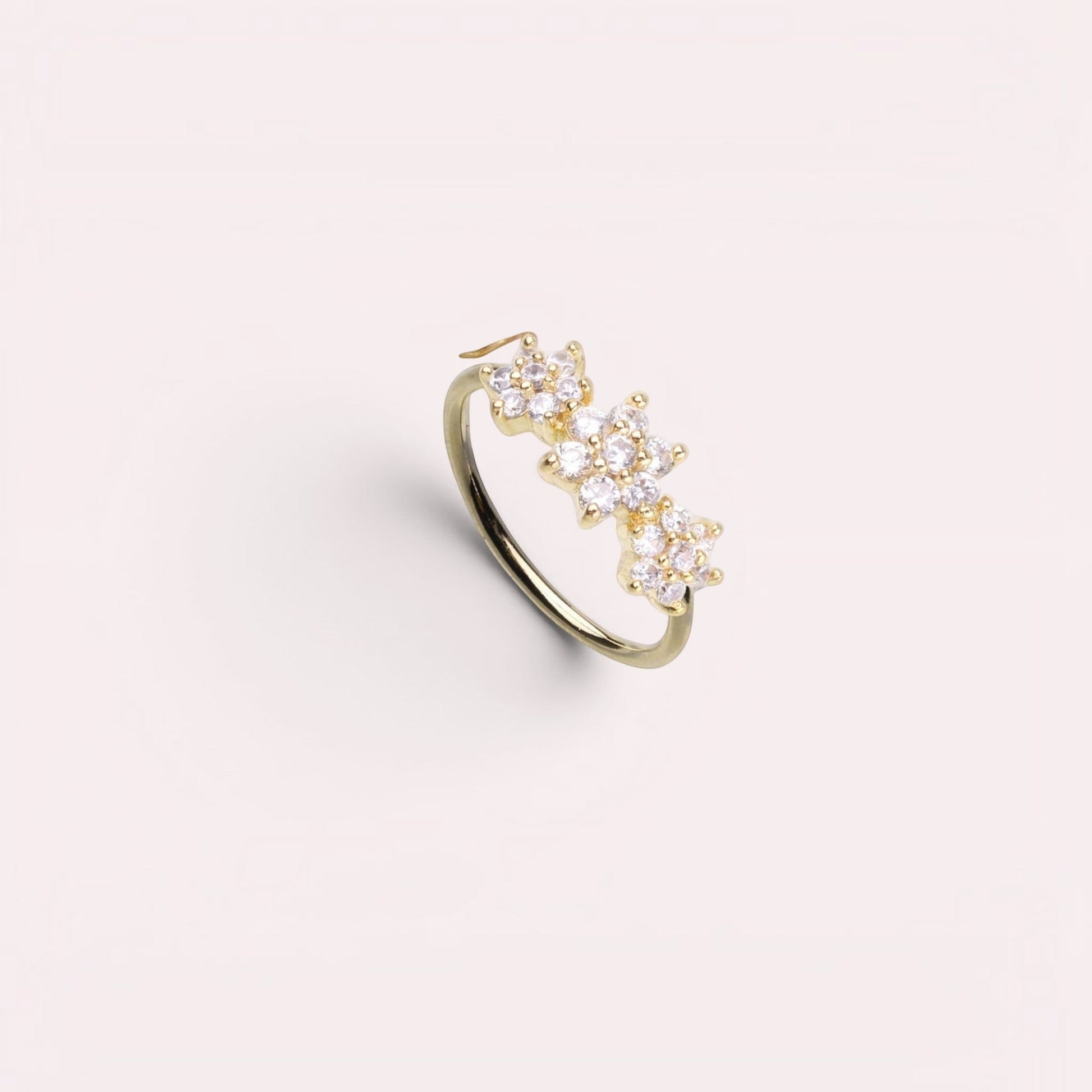 MKBodyJewelry gold surgical steel nose hoop with three sparkling CZ floral gems for nose or cartilage piercing