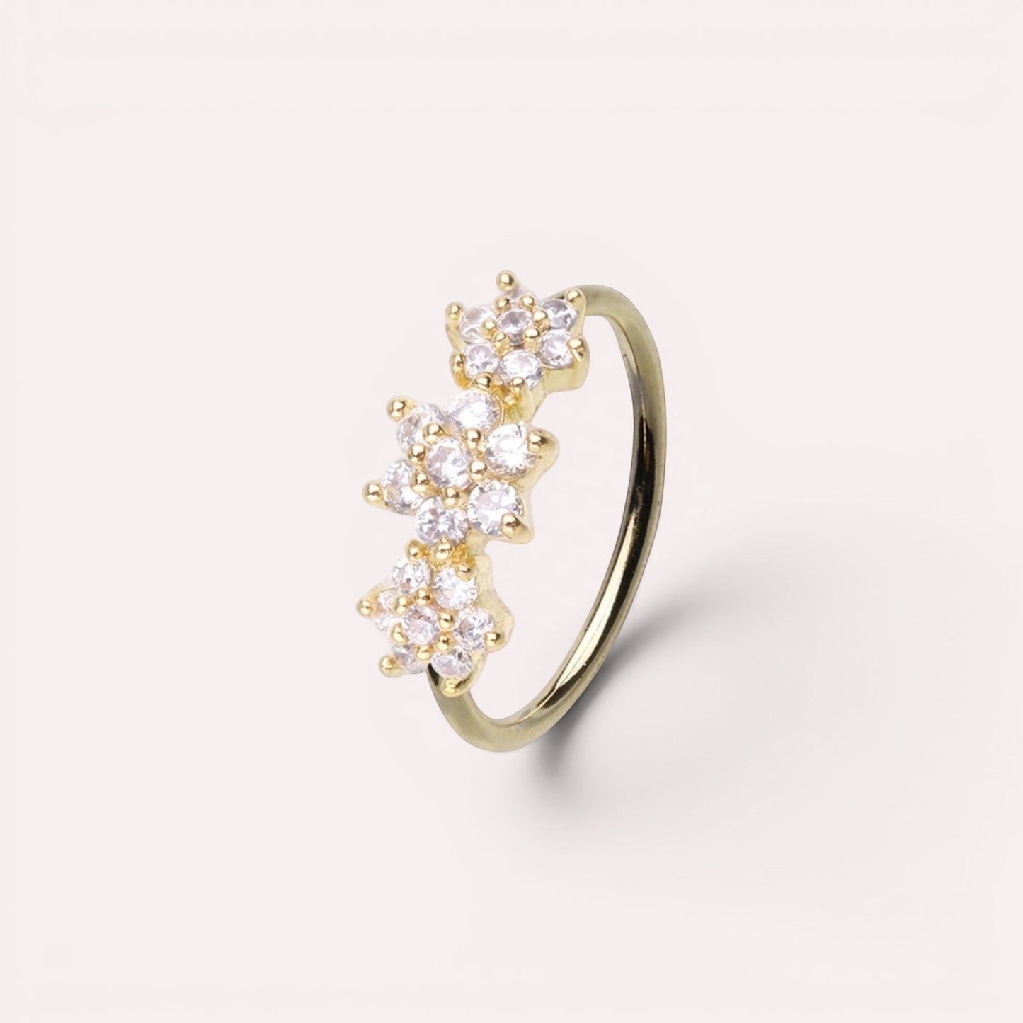 MKBodyJewelry 20g gold surgical steel nose hoop with three sparkling CZ floral gems for nose or cartilage piercing.