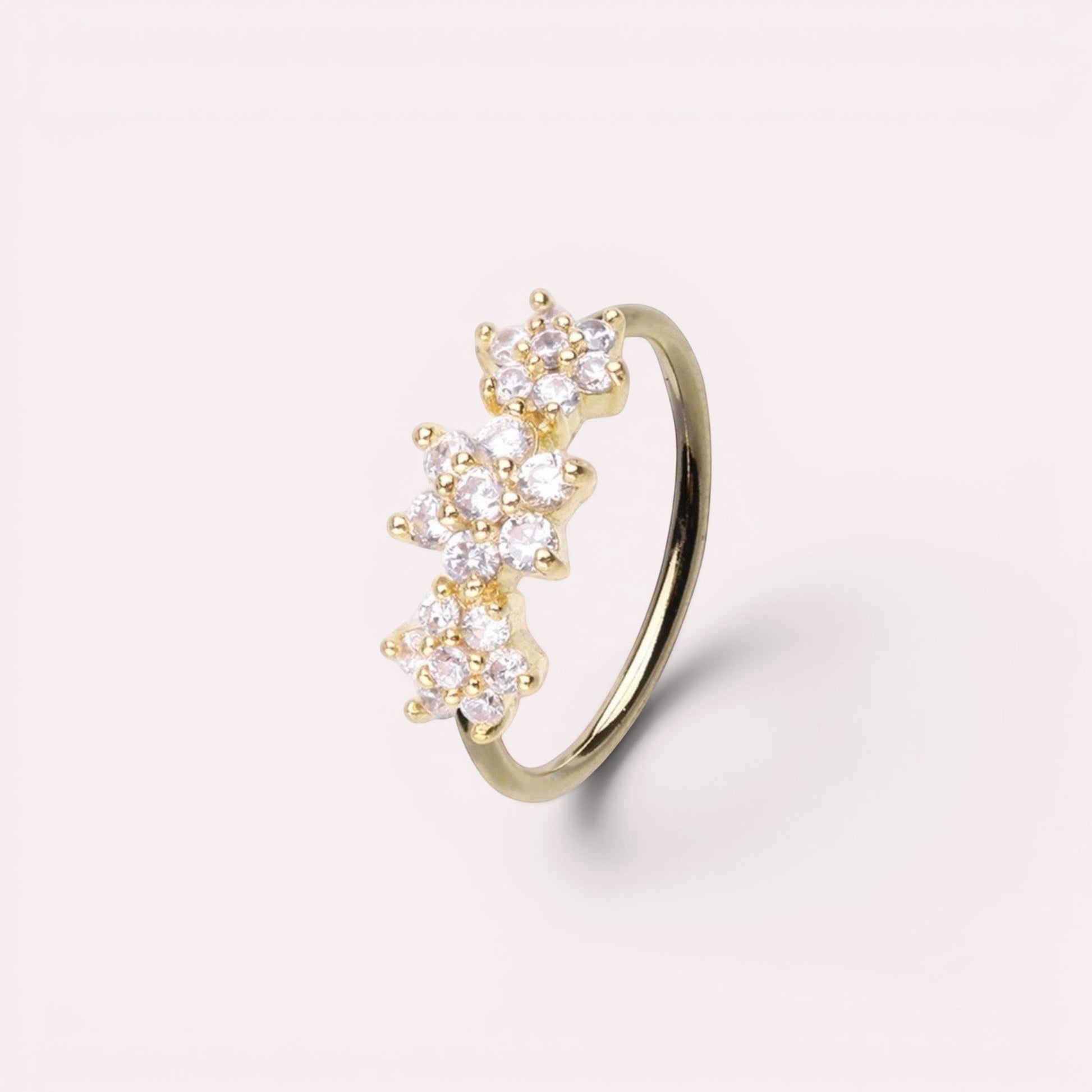 MKBodyJewelry 20g gold surgical steel nose hoop with three sparkling CZ floral gems for nose or cartilage piercing.