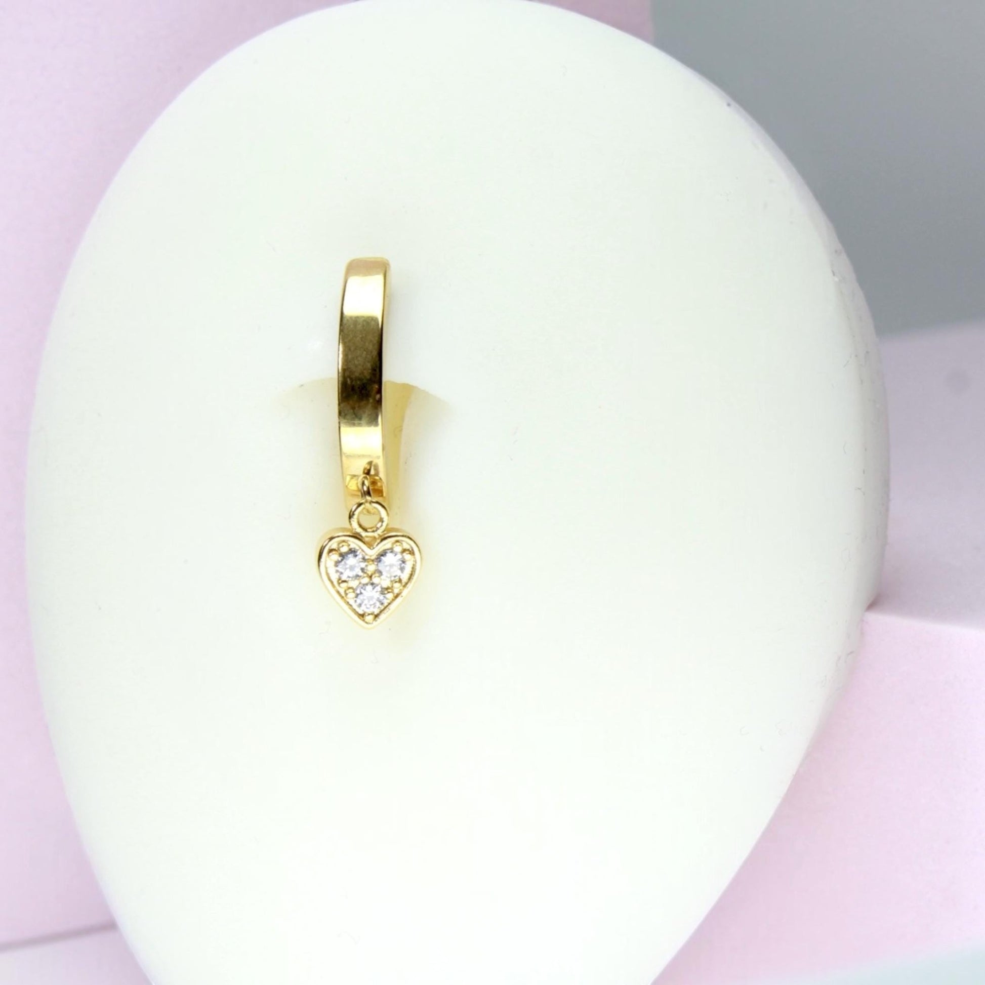 MKBodyJewelry gold surgical steel belly button ring featuring a dainty heart charm with clear crystals