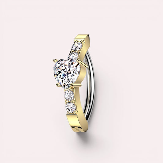MKBodyJewelry gold heart belly button clicker ring with CZ stones, crafted from surgical steel in a 14g hinged design.