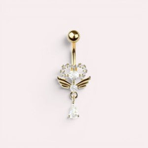 MKBodyJewelry gold heart belly button ring with angel wings, cubic zirconia stones, and a dangling teardrop charm.