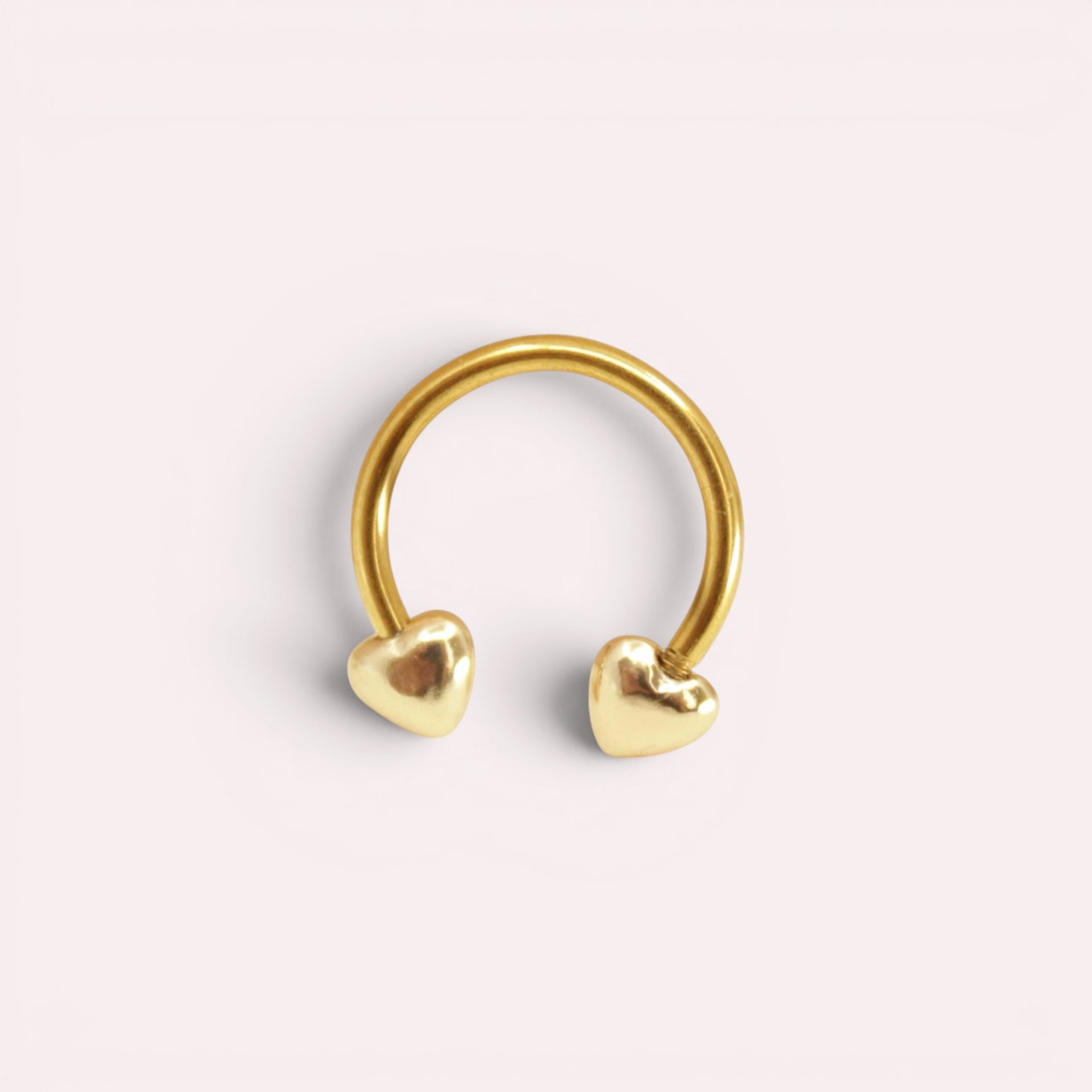 MKBodyJewelry 16G gold surgical steel horseshoe septum ring featuring minimalist heart-shaped ends.