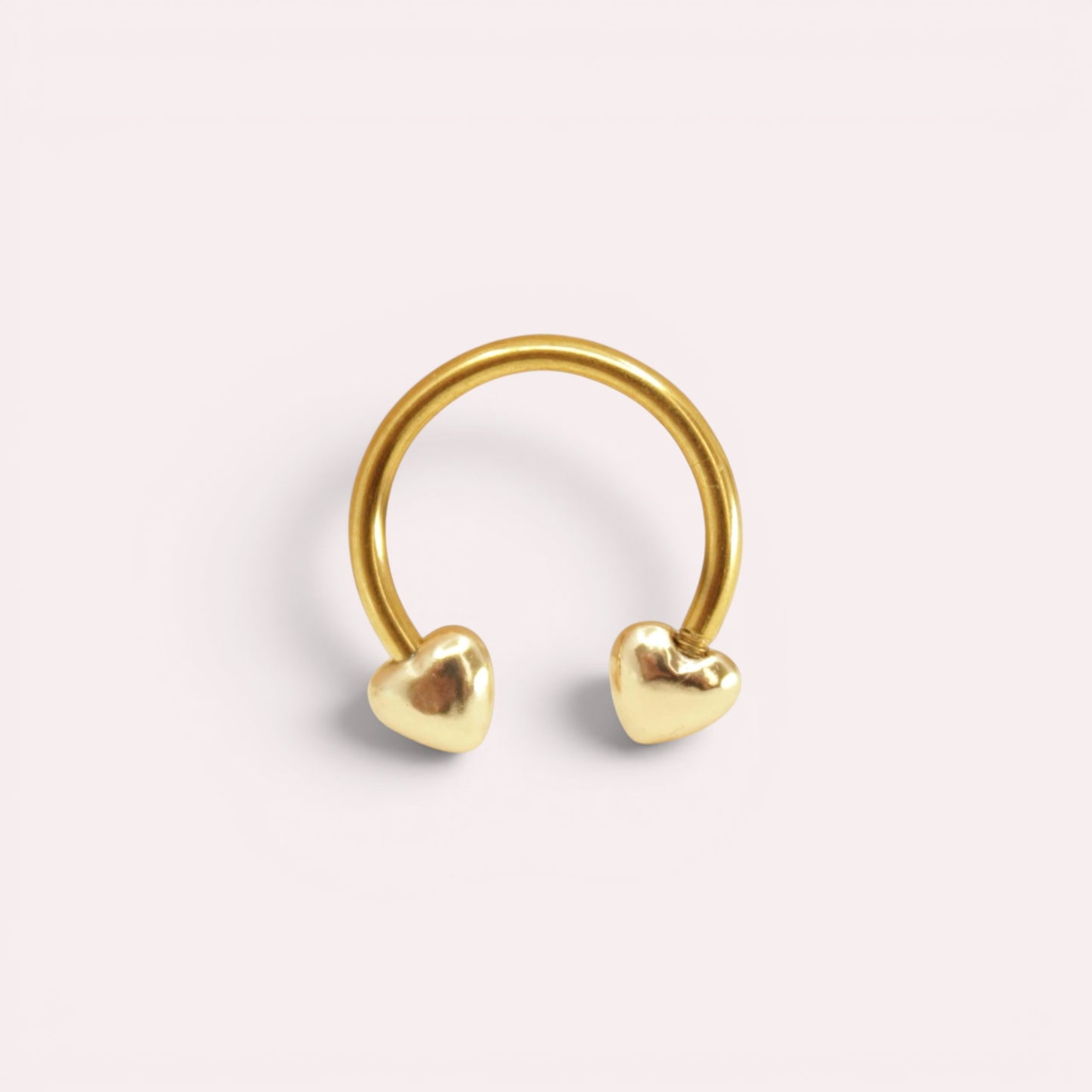 MKBodyJewelry 16G gold surgical steel horseshoe septum ring featuring minimalist heart-shaped ends.
