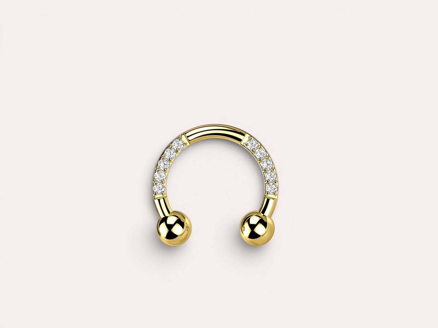 MKBodyJewelry gold horseshoe earring with pave CZ sides and ball ends. Implant grade titanium.