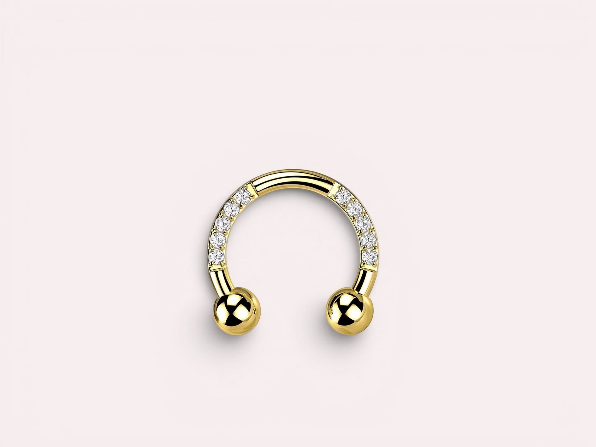 MKBodyJewelry gold horseshoe earring with pave CZ sides and ball ends. Implant grade titanium.