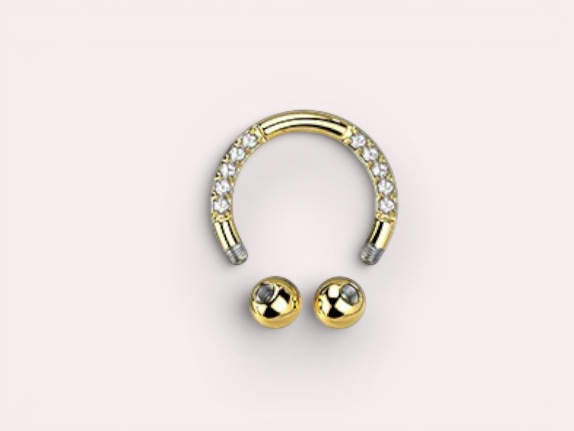 MKBodyJewelry gold horseshoe earring with pave CZ sides and two gold balls. Implant grade titanium.