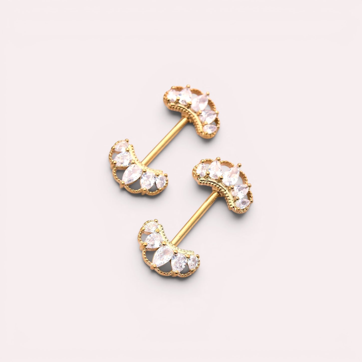 MKBodyJewelry gold 14g nipple barbells with CZ paved marquise leaf design. Sold as a pair.