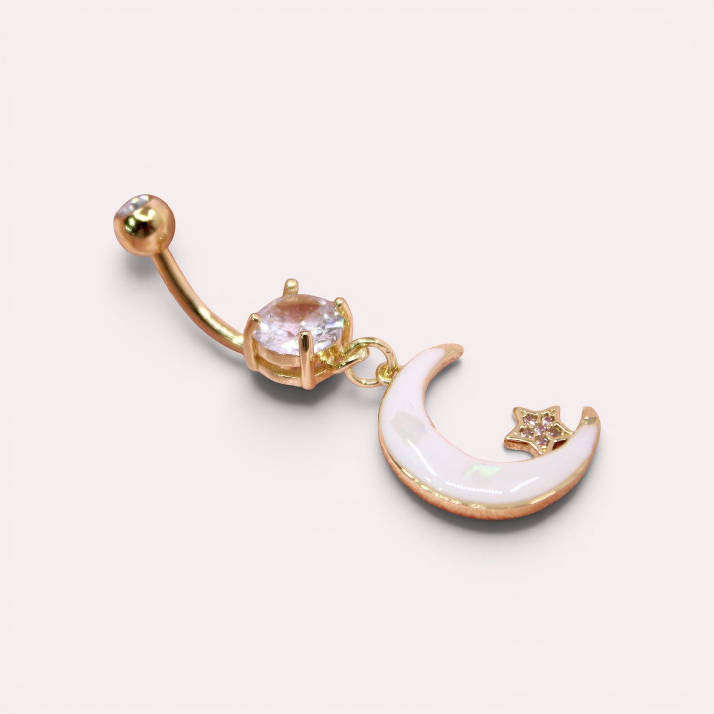 MKBodyJewelry gold stainless steel belly button ring with a dangling white moon and star charm and clear crystal.