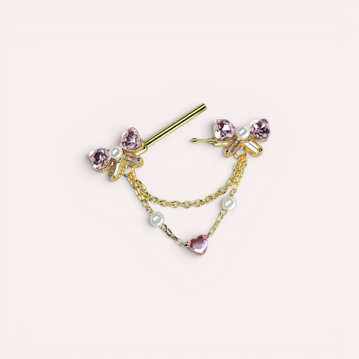 MKBodyJewelry gold 14g nipple barbell with pink bow heart charms, pearls, and chains. Surgical steel.