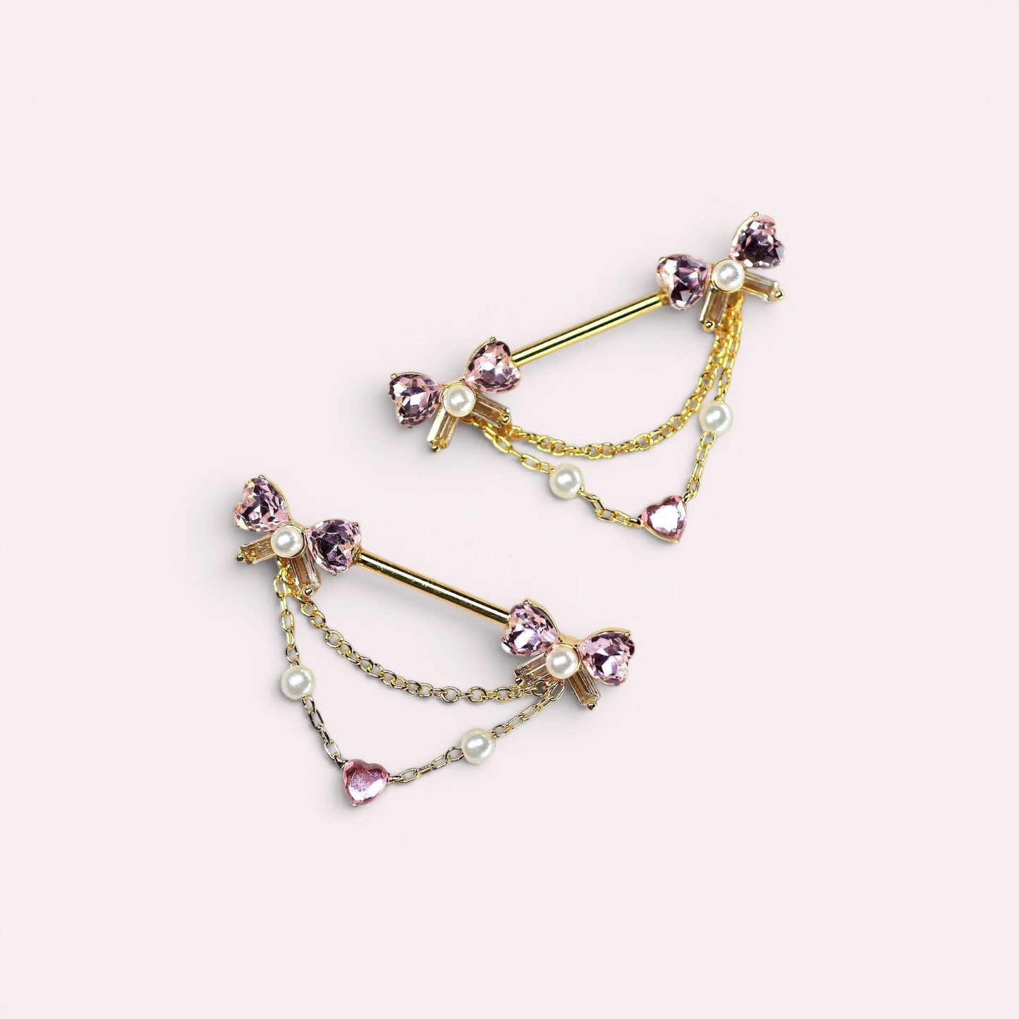 MKBodyJewelry 14g gold surgical steel nipple barbell with pink bow heart dangle and pearl accents.