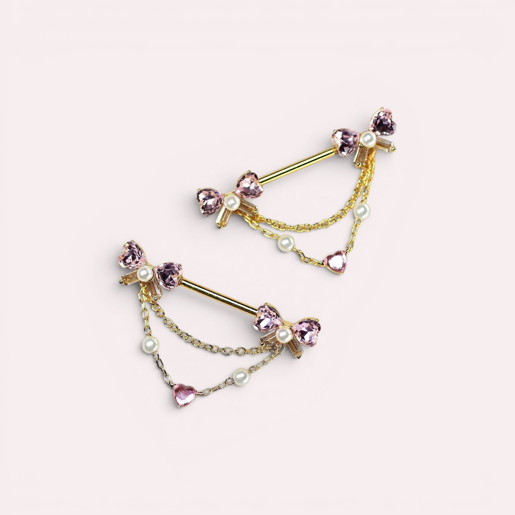 MKBodyJewelry 14g gold surgical steel nipple barbell with pink bow heart dangle and pearl accents.