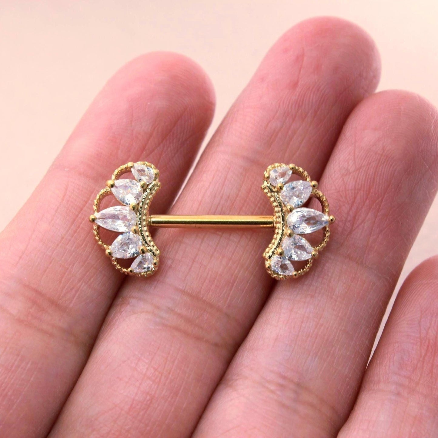 MKBodyJewelry 14g gold nipple barbell with clear CZ paved floral petal leaf design. Surgical steel.