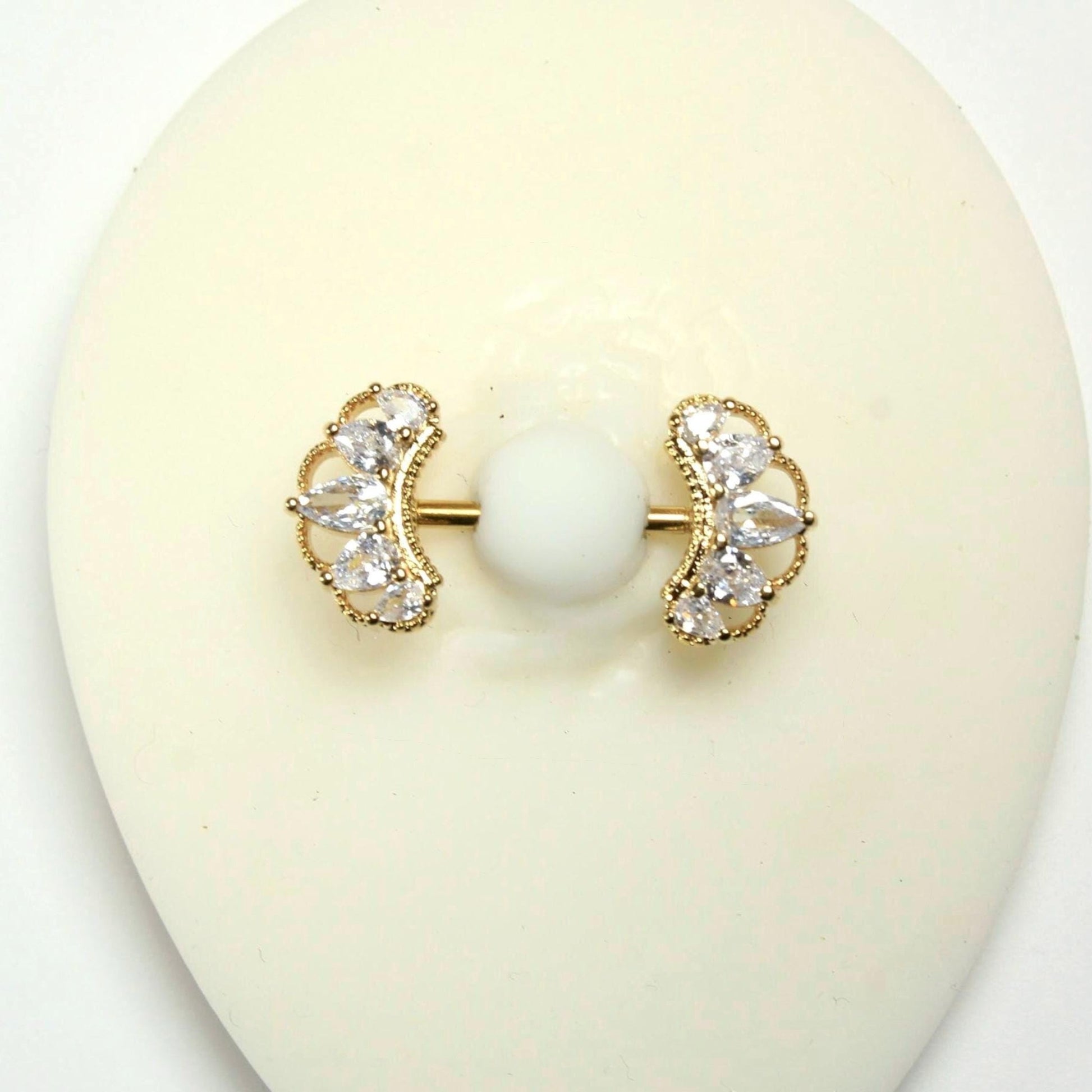 MKBodyJewelry 14g gold nipple barbell with clear CZ paved floral petal leaf design. Surgical steel.