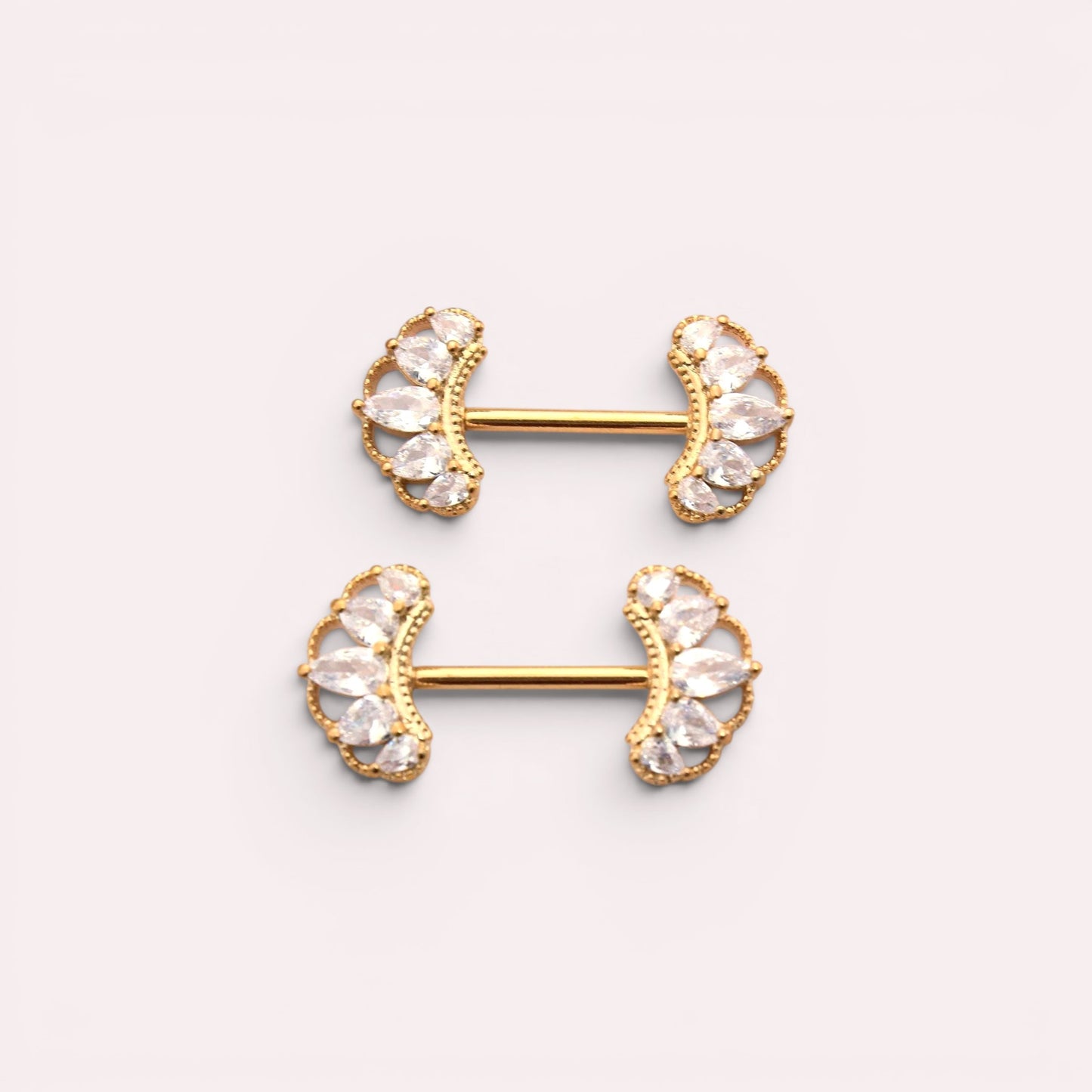 MKBodyJewelry 14g gold nipple barbells with clear CZ paved floral leaf design. Sold as a pair.