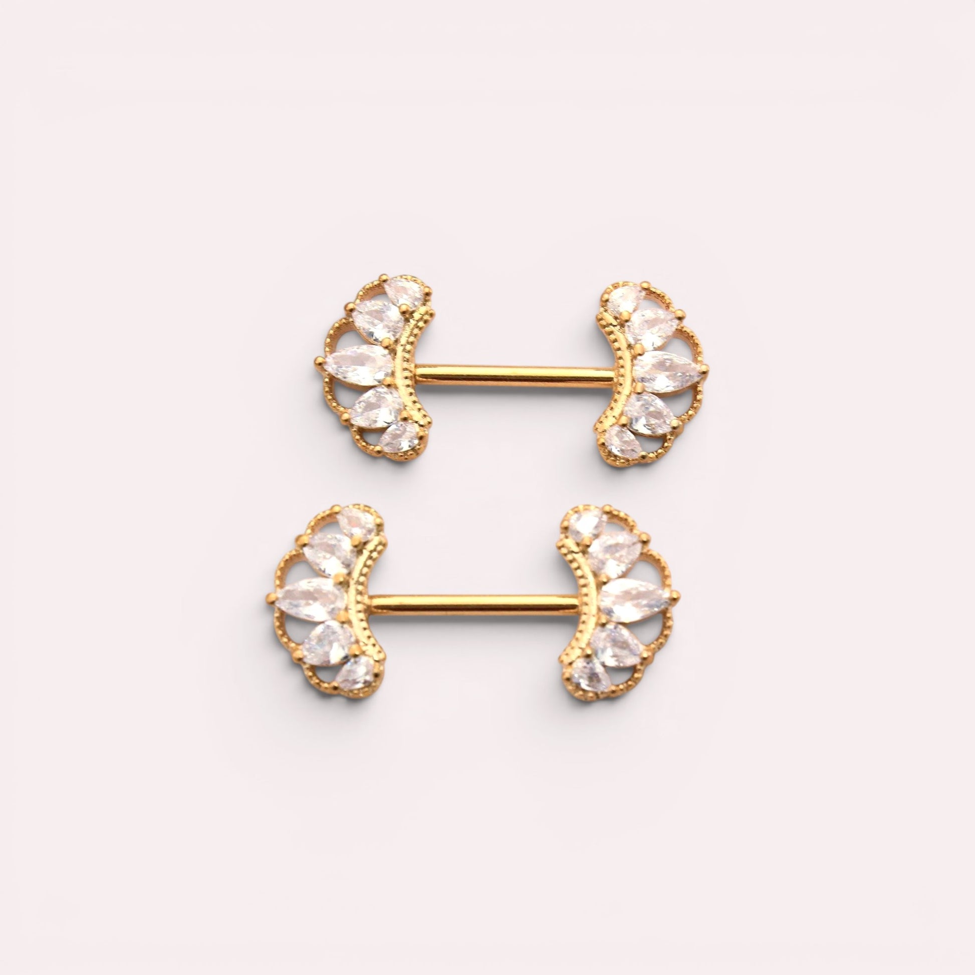 MKBodyJewelry 14g gold nipple barbells with clear CZ paved floral leaf design. Sold as a pair.