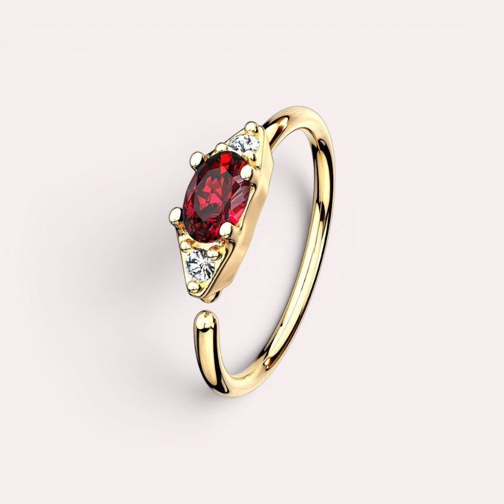 MKBodyJewelry 20g gold nose hoop ring with red oval gem and two clear accent gems.