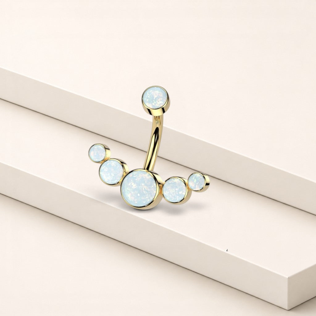 MKBodyJewelry gold titanium floating navel piercing with five white opal stones in a minimalist curved design.