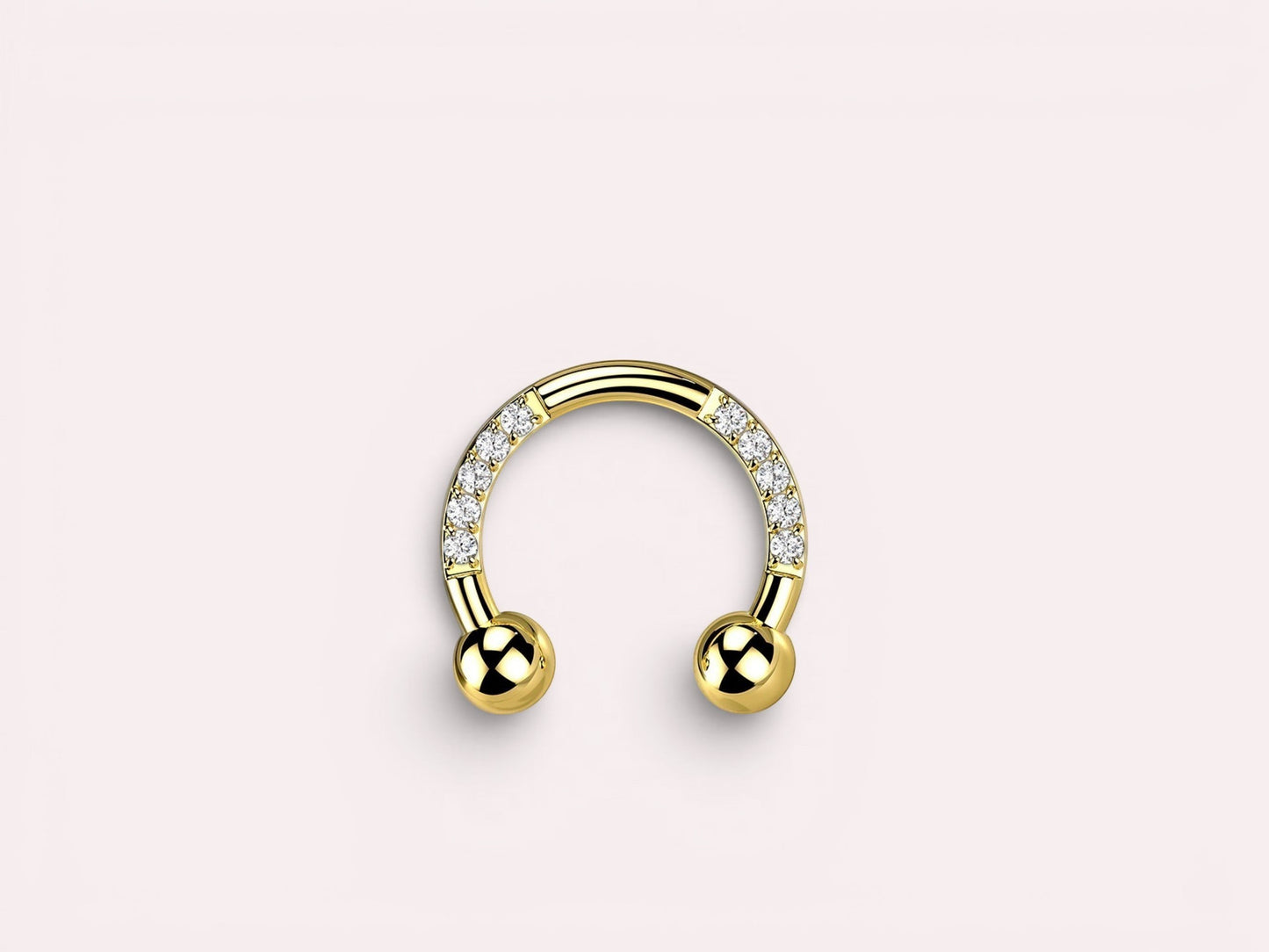 MKBodyJewelry gold horseshoe earring with pave CZ sides and ball ends. Implant grade titanium.
