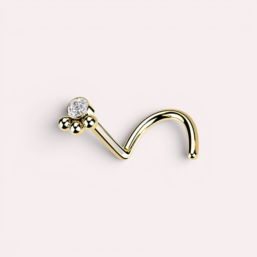 MKBodyJewelry gold stainless steel 20G L-shape nose stud featuring a dainty paw print design with a clear crystal.