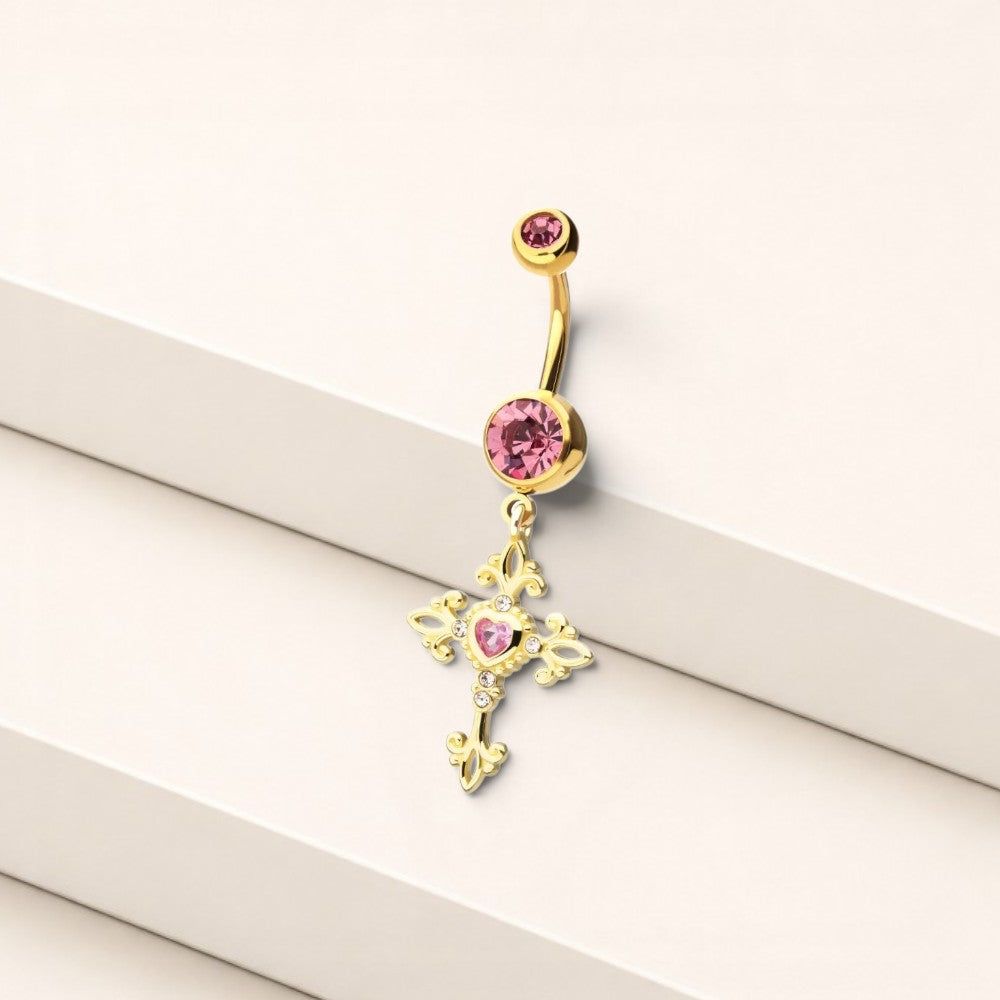 MKBodyJewelry gold tone belly ring with a hot pink gem and ornate dangling cross charm, 14g surgical steel navel jewelry