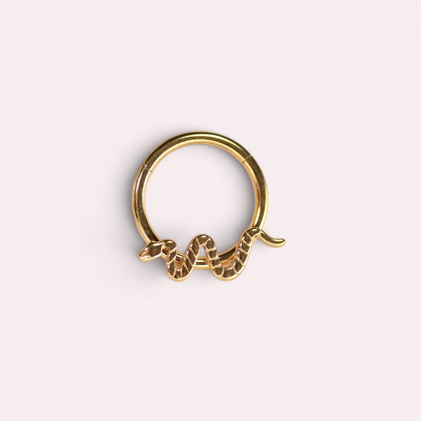 MKBodyJewelry gold titanium snake septum clicker ring with a hinged hoop design for cartilage piercings.