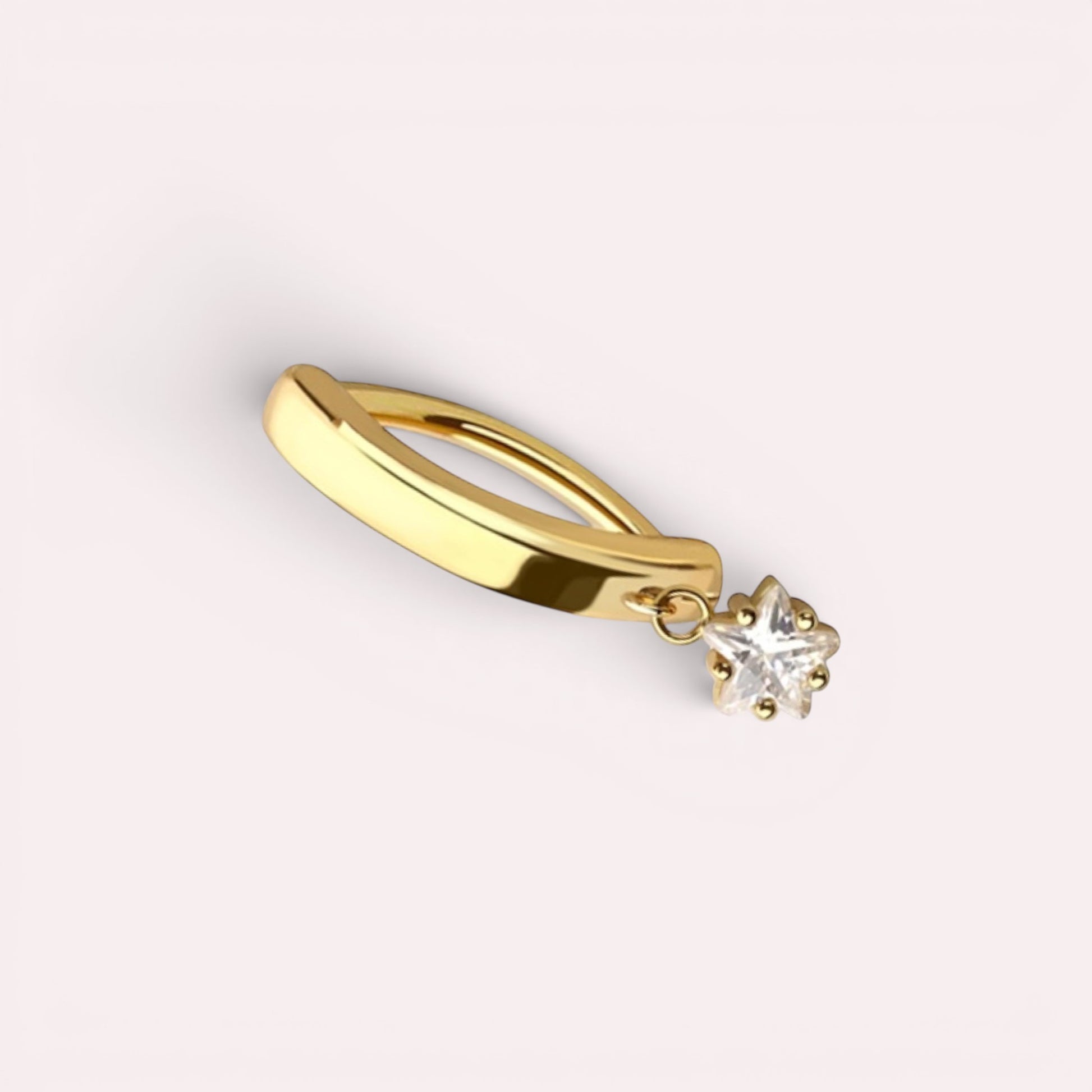 MKBodyJewelry gold surgical steel belly button ring featuring a minimalist dangling star charm on a clicker hoop.