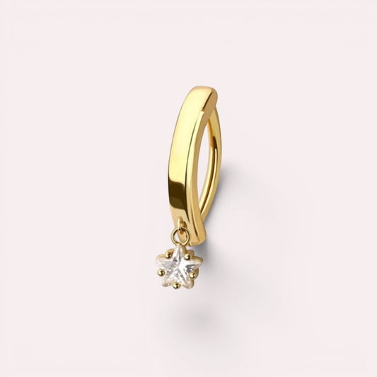 MKBodyJewelry gold surgical steel belly button ring with a minimalist dangling star charm on a light background.