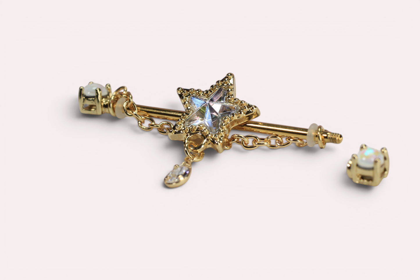 MKBodyJewelry 14G gold industrial barbell with a star charm and dangling cz. Surgical steel, 35mm length.