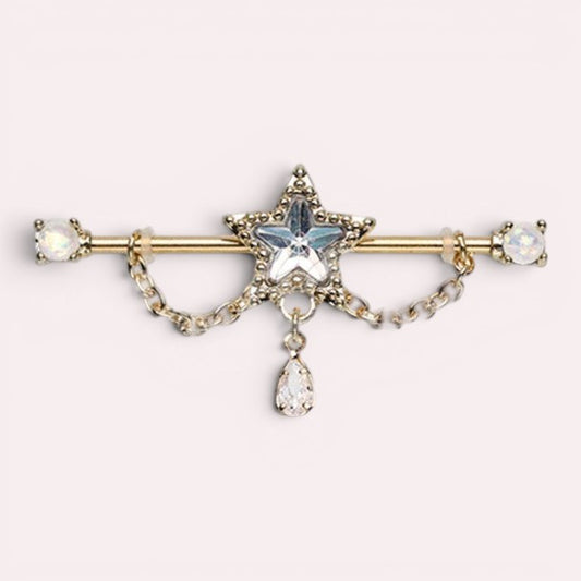 MKBodyJewelry 14G gold industrial barbell with dangling chain, star charm, and teardrop gem. Surgical steel.