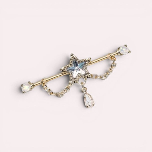 MKBodyJewelry 14G gold industrial barbell with a central star charm and dangling teardrop gem. Features opal end gems.