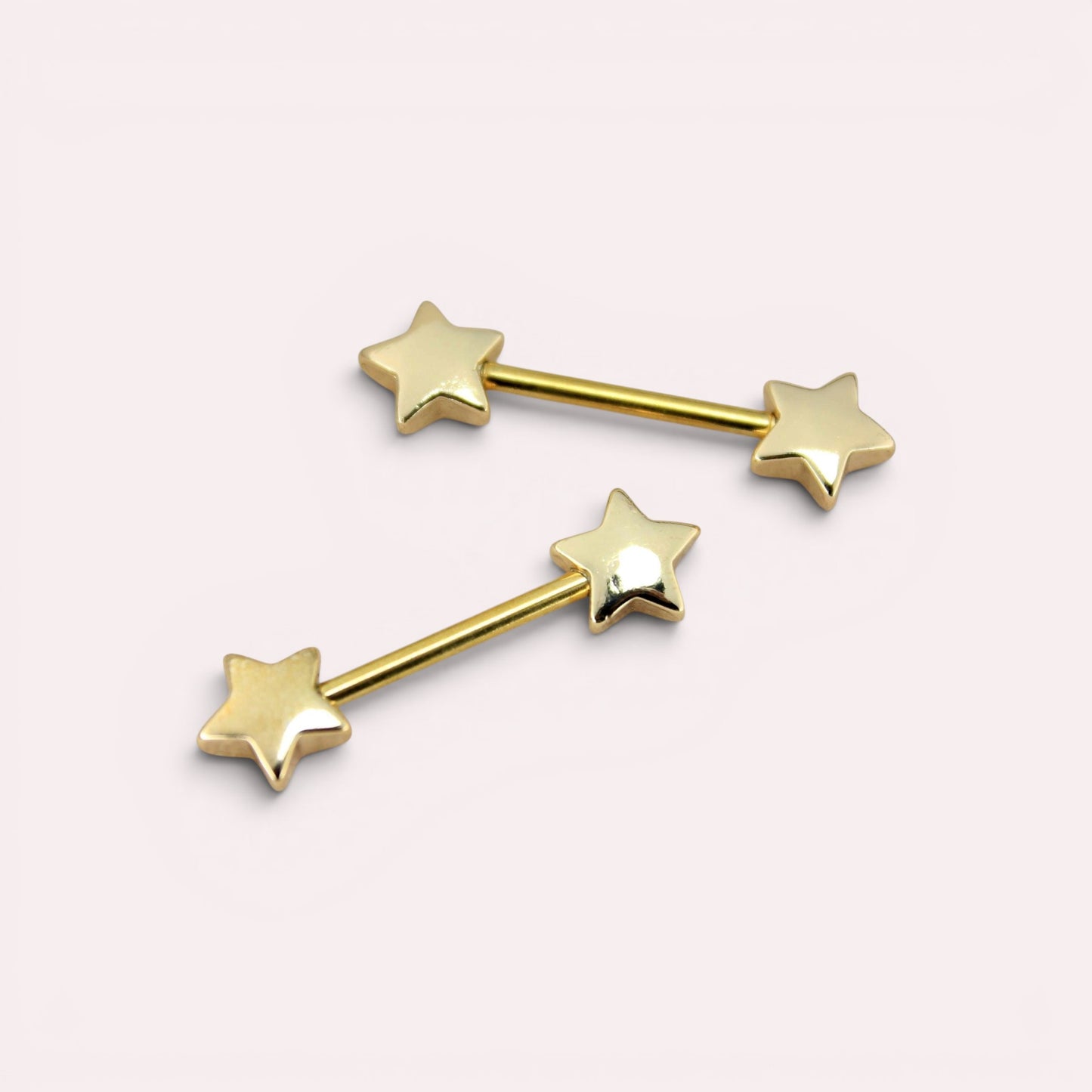 MKBodyJewelry 14G gold nipple barbell set with minimalist star ends, crafted from hypoallergenic surgical steel.