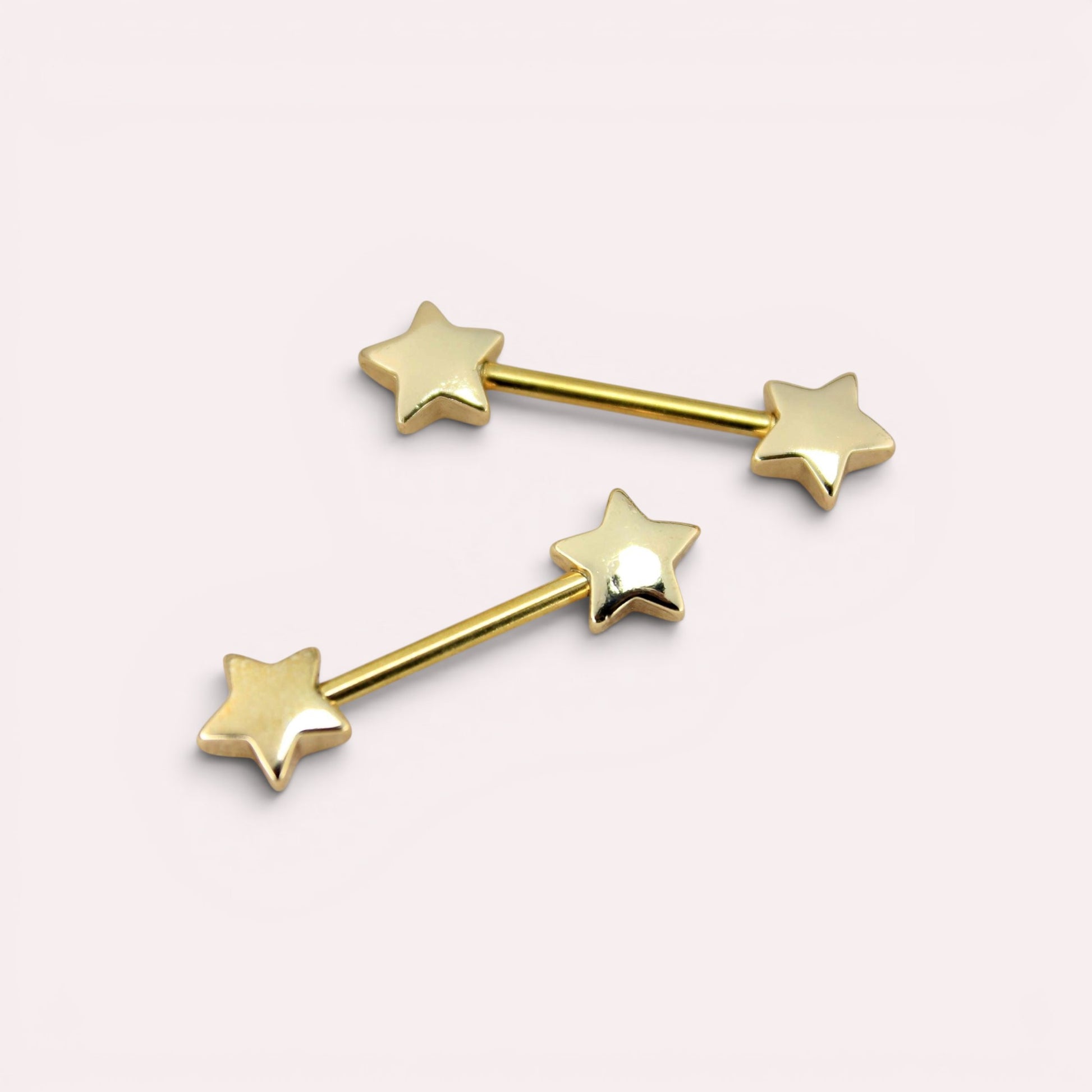 MKBodyJewelry 14G gold nipple barbell set with minimalist star ends, crafted from hypoallergenic surgical steel.