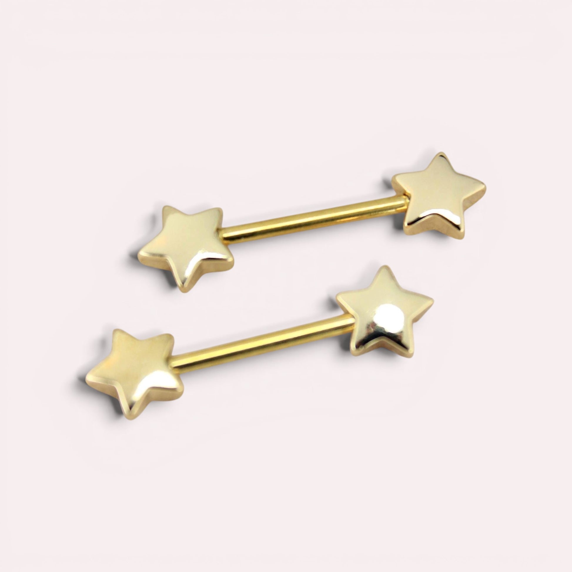 MKBodyJewelry 14G gold-tone surgical steel nipple barbells with minimalist star ends, sold as a pair.