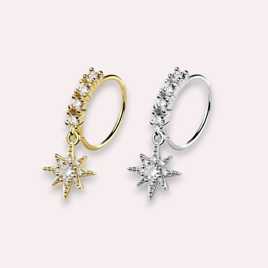 MKBodyJewelry 20g gold surgical steel nose hoop with a dangling CZ star charm and sparkling crystal accents.