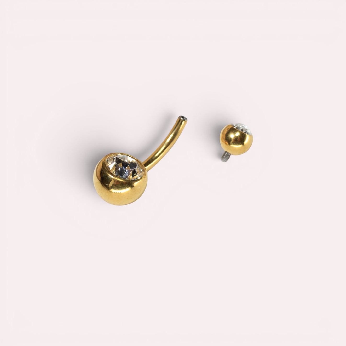MKBodyJewelry gold titanium belly button ring with internally threaded double CZ jewels in a sleek honeycomb setting.