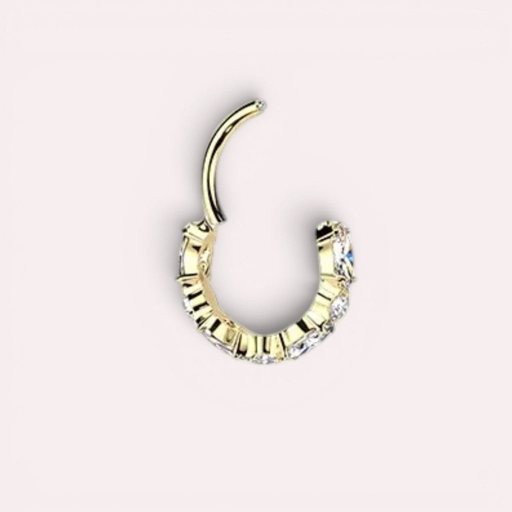 MKBodyJewelry gold titanium nose clicker ring featuring a row of sparkling CZ gems in a dainty hinged hoop design.