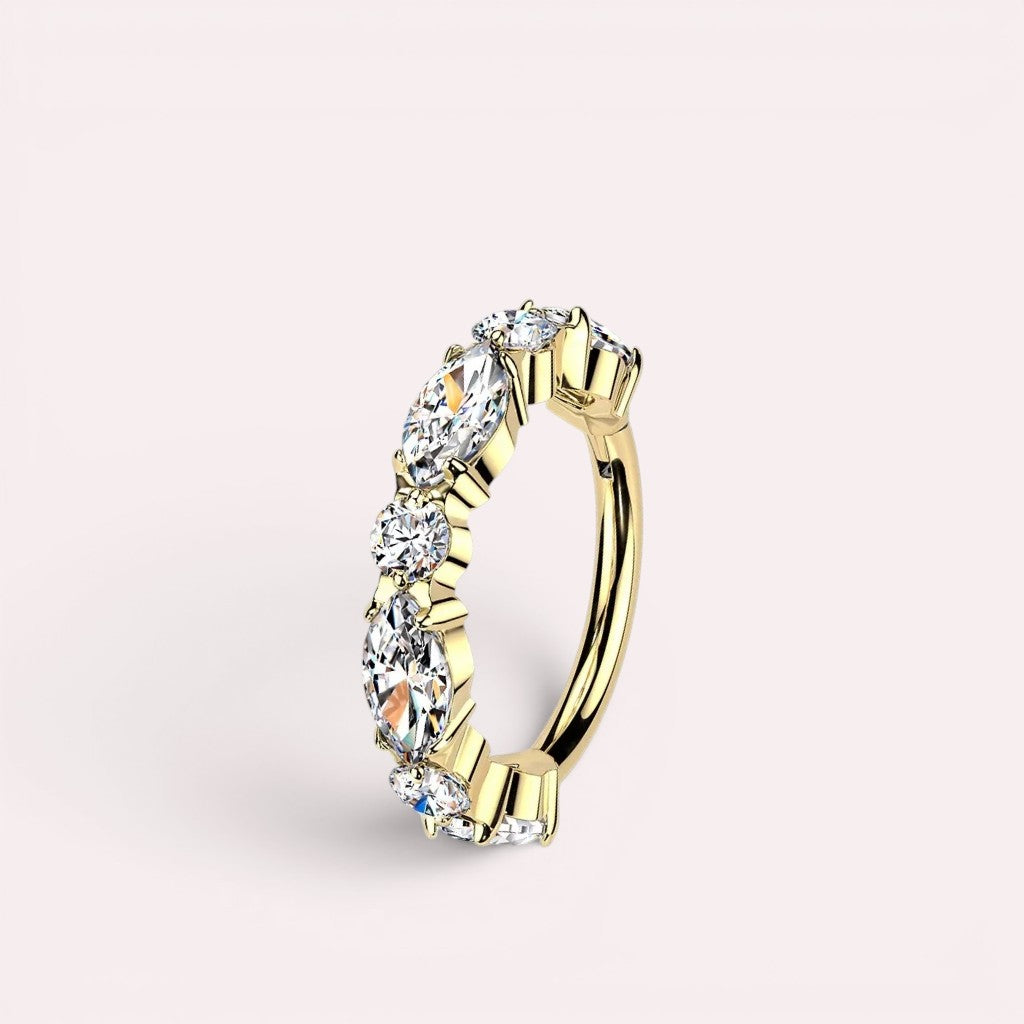 MKBodyJewelry gold titanium nose clicker ring featuring a row of sparkling CZ gems in a minimalist hinged hoop design.