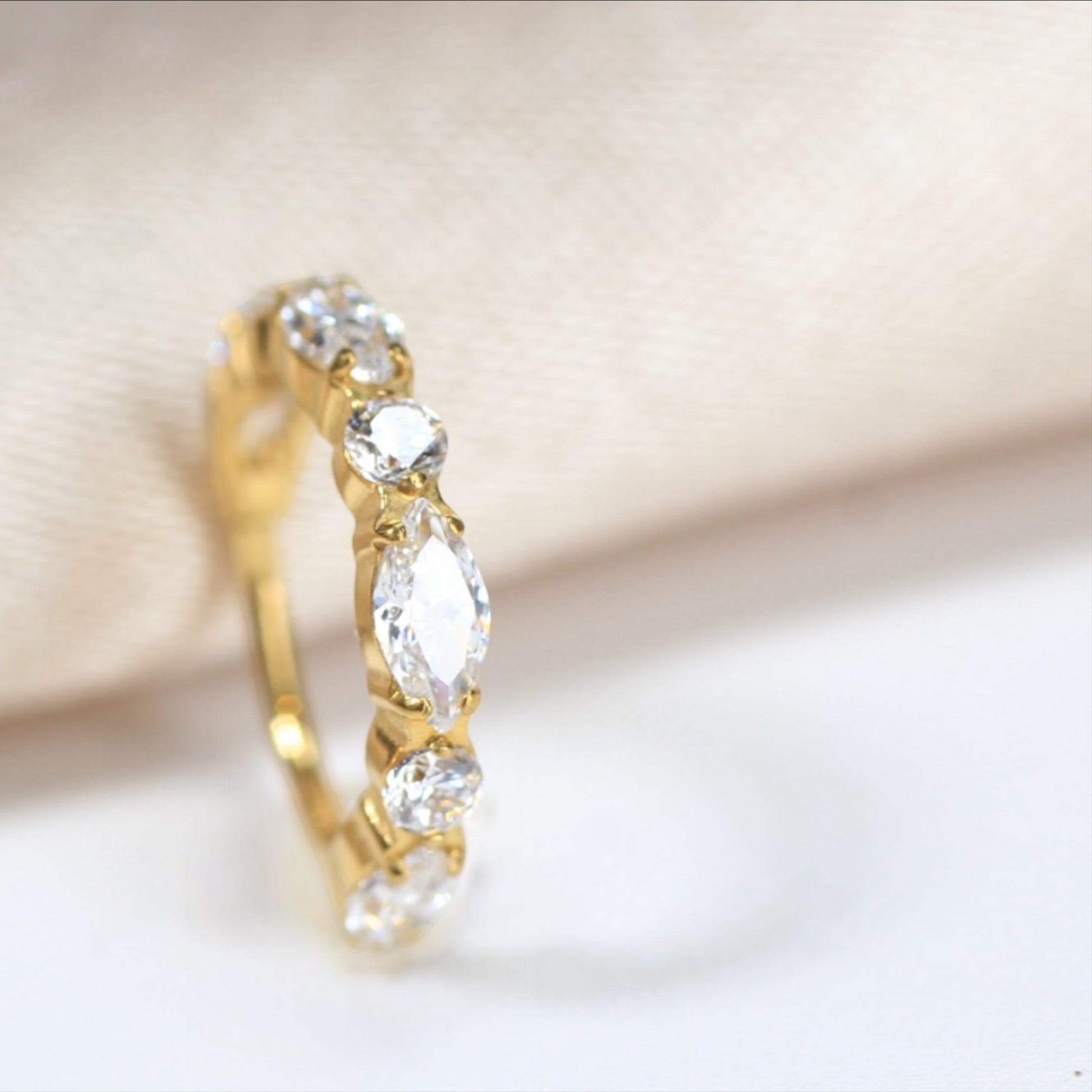 MKBodyJewelry gold titanium nose clicker ring featuring marquise and round CZ gems for a dainty, secure fit.