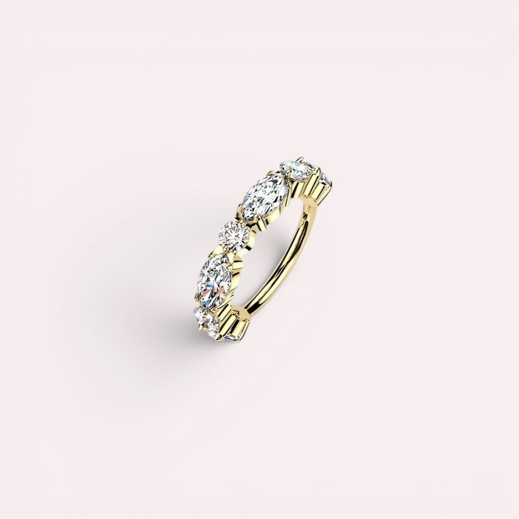 MKBodyJewelry gold titanium nose clicker ring featuring sparkling CZ gems in a dainty hinged hoop design.