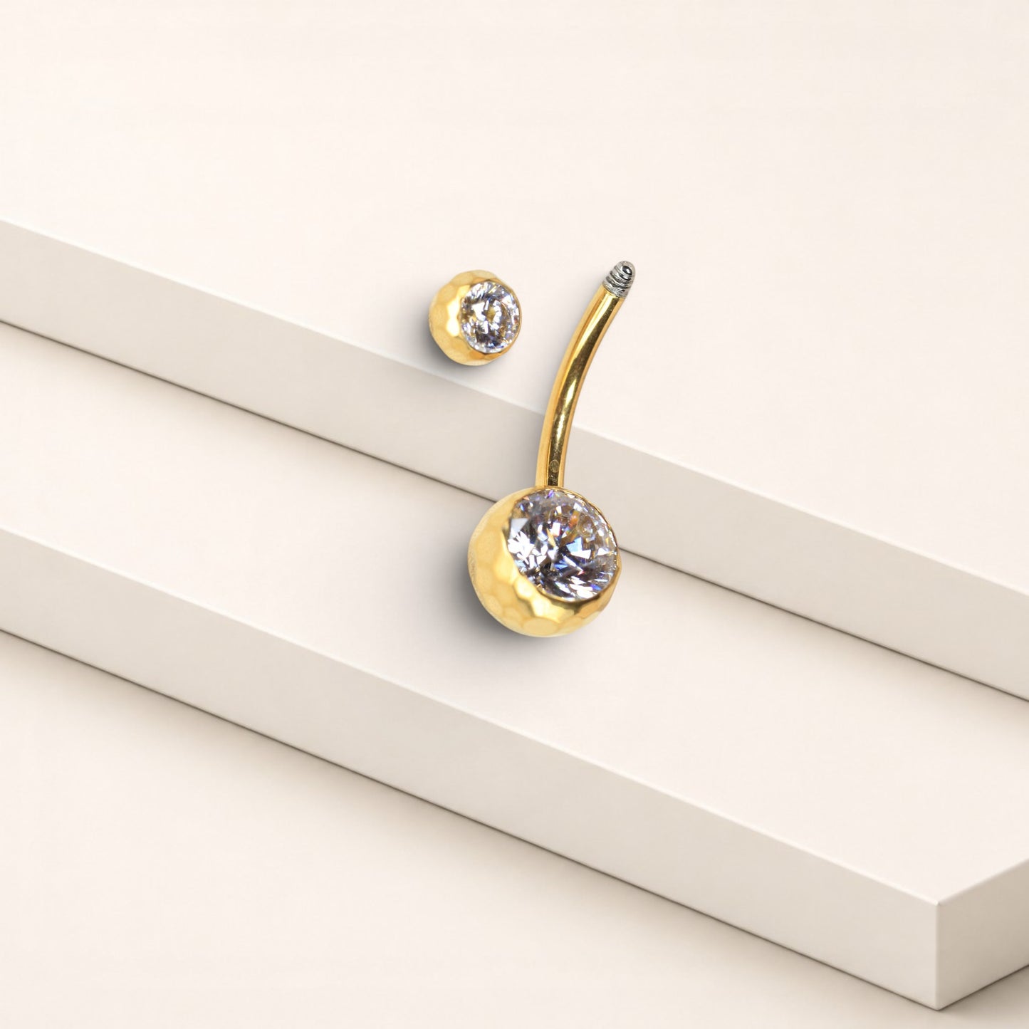 MKBodyJewelry gold titanium belly button ring with a faceted honeycomb setting and sparkling CZ stone