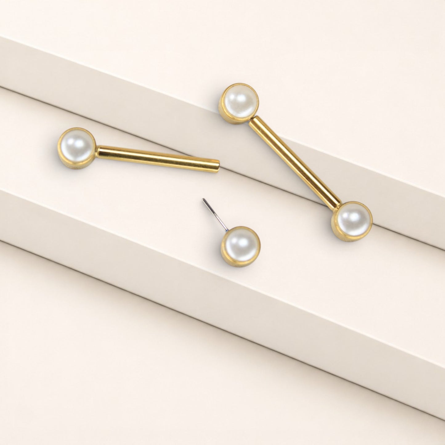 MKBodyJewelry 14g gold titanium threadless nipple barbells with 5mm pearl ends, hypoallergenic and nickel-free.