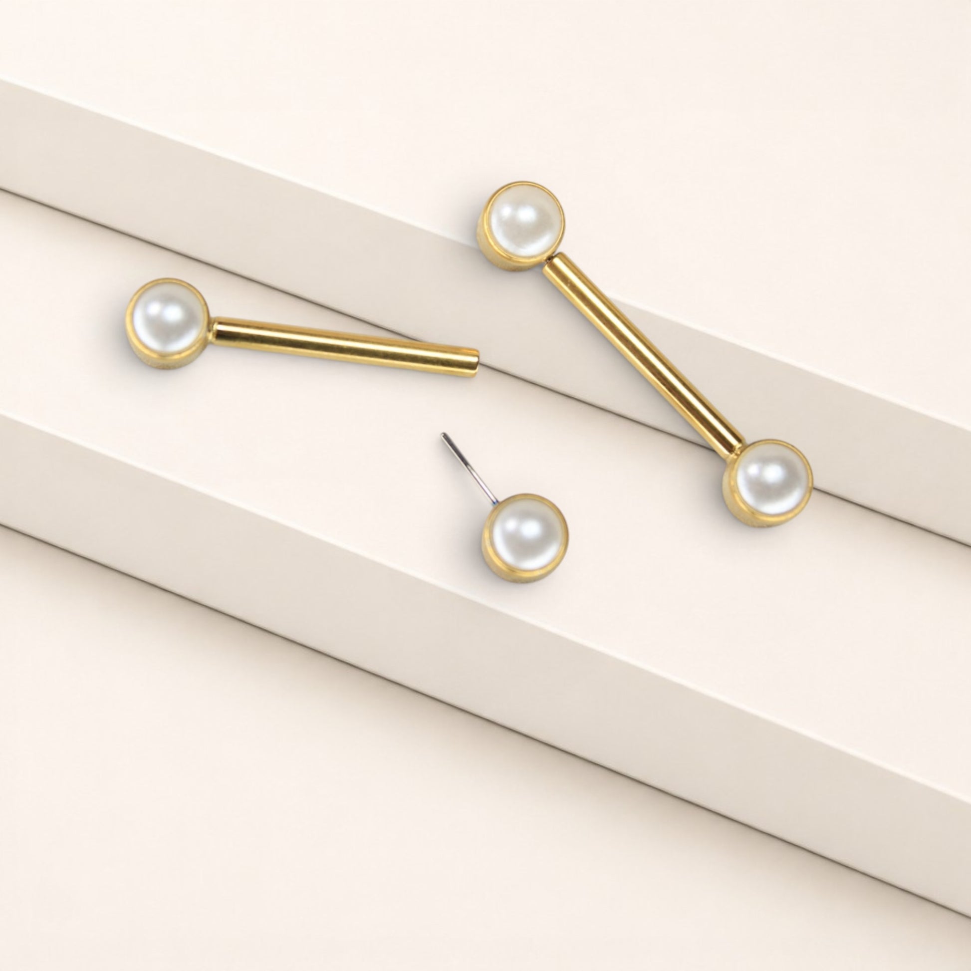 MKBodyJewelry 14g gold titanium threadless nipple barbells with 5mm pearl ends, hypoallergenic and nickel-free.