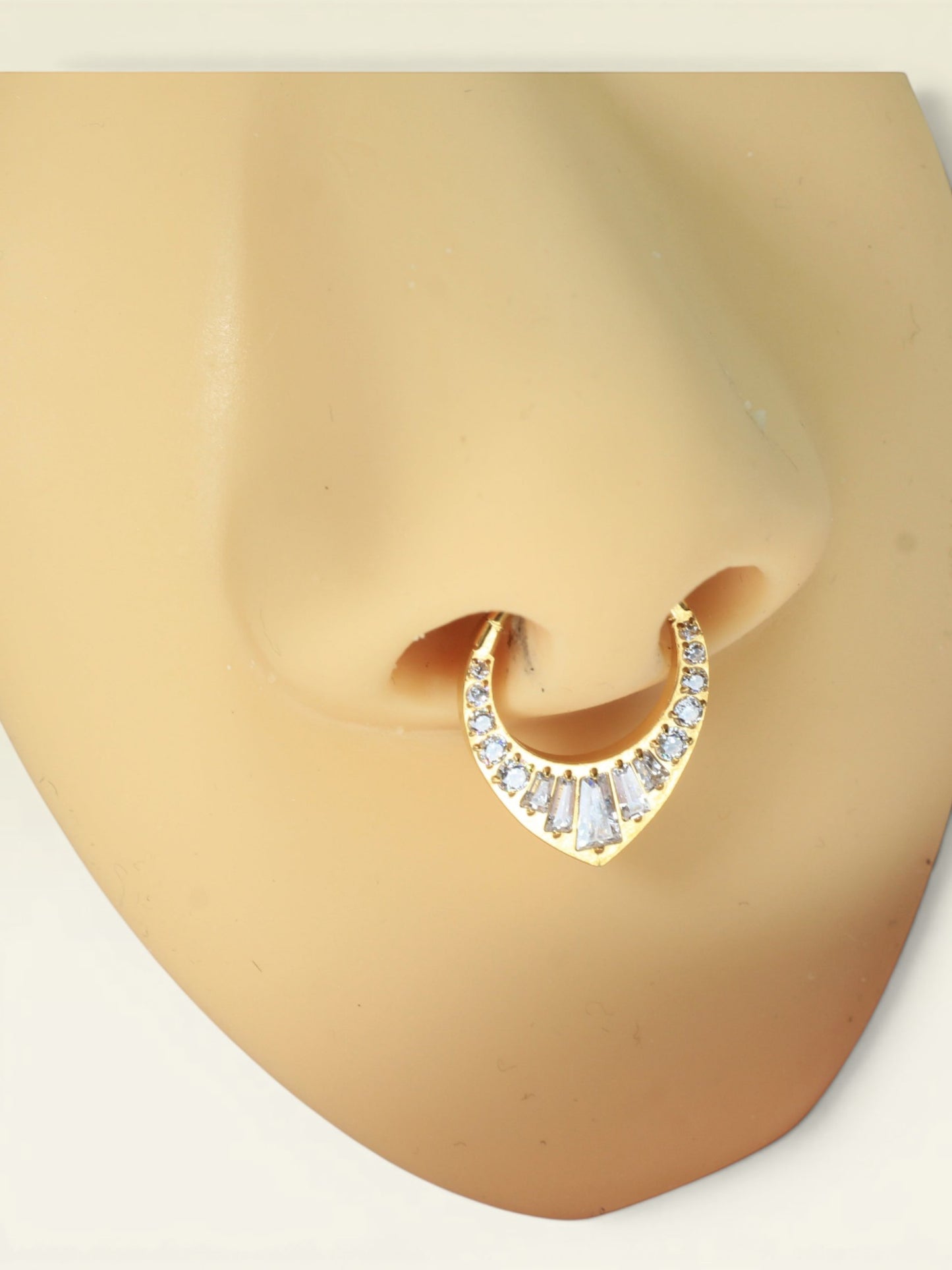 MKBodyJewelry gold titanium 16g septum clicker hoop with V-shaped CZ gems. Suitable for sensitive skin.