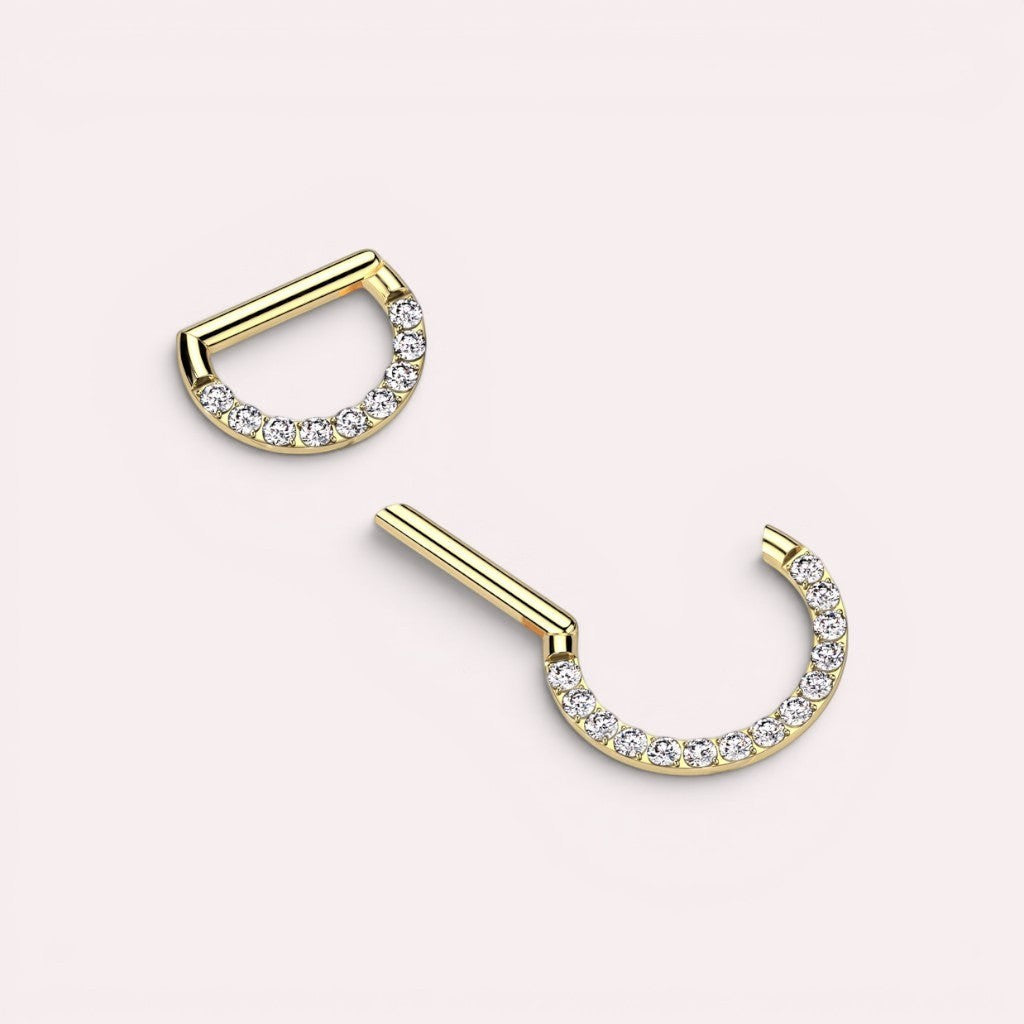 MKBodyJewelry 16G gold titanium septum clicker ring with a dainty line of sparkling gems for daith or nose piercings.