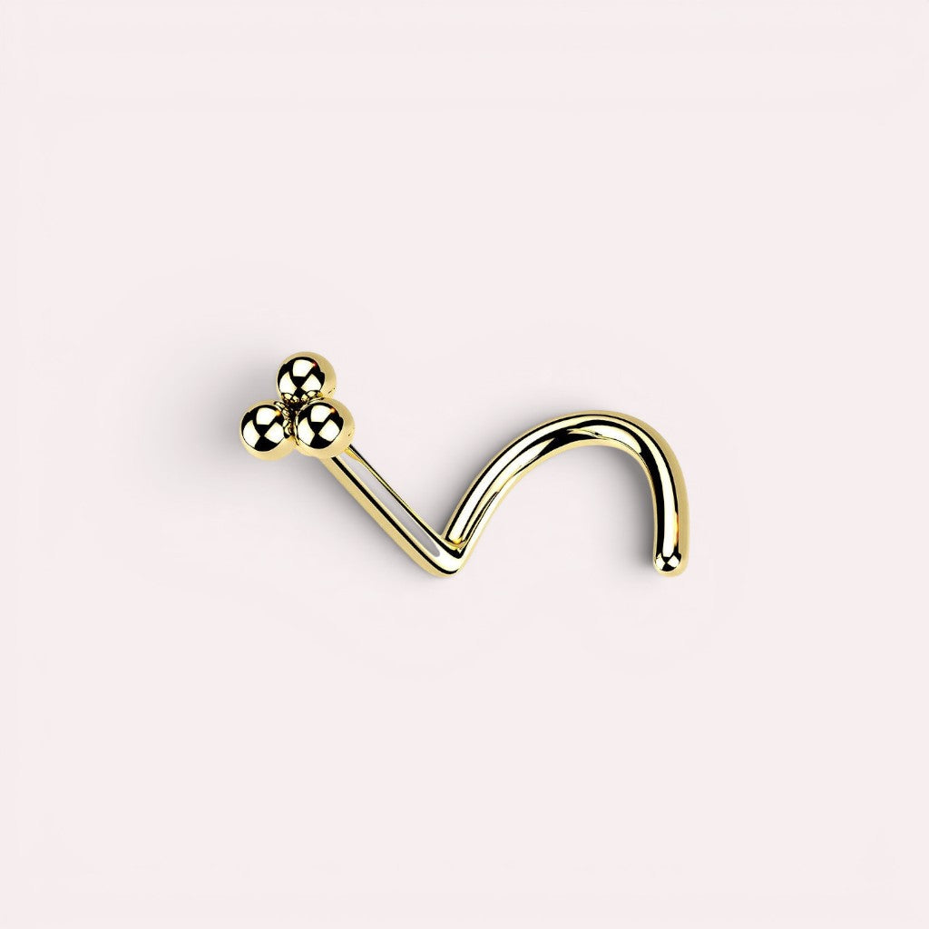 MKBodyJewelry gold triple ball nose screw with a polished finish and secure curved design for facial piercings.