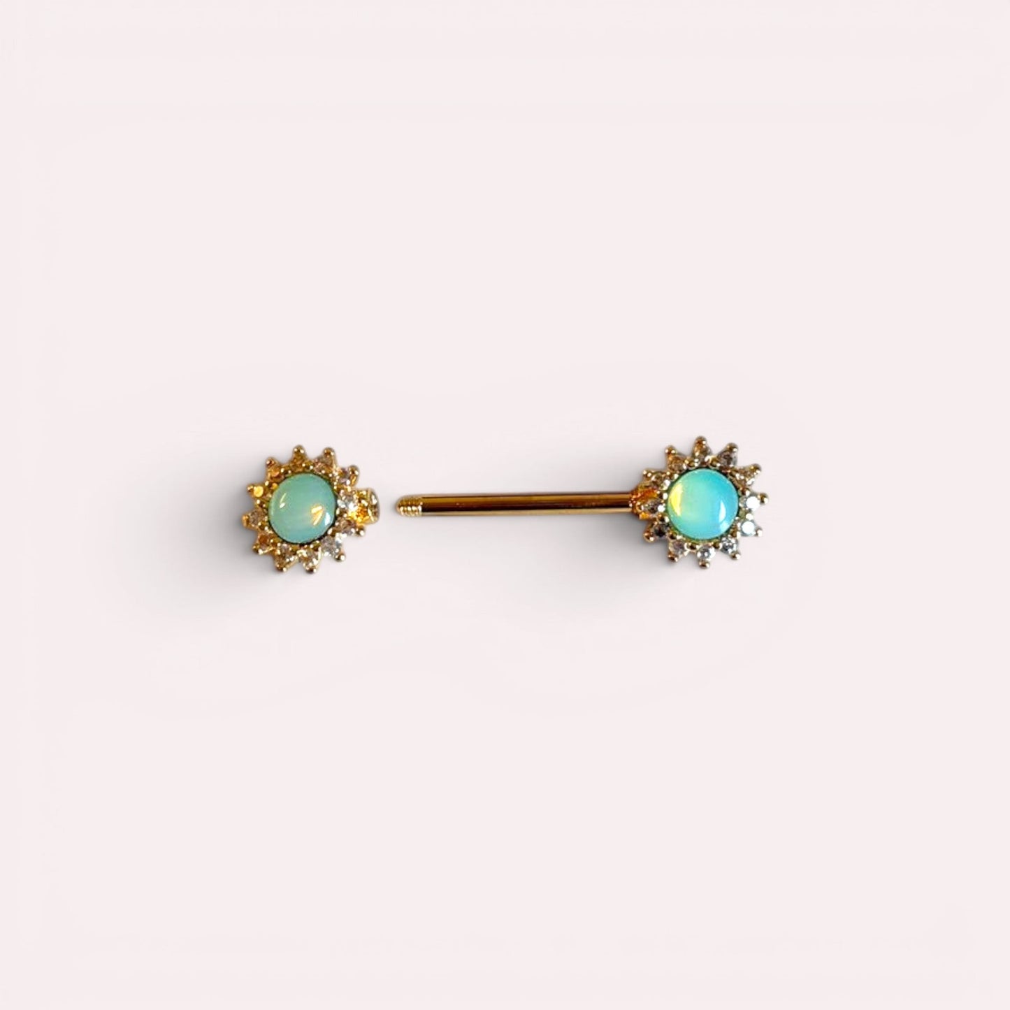 MKBodyJewelry green opal gem sun decorative end nipple piercing barbells crafted with surgical steel. Sold in pairs.