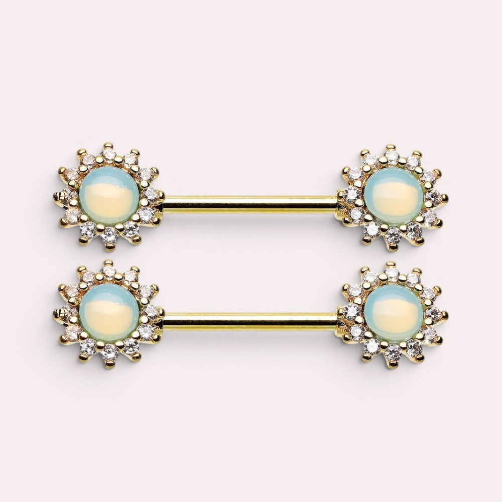 MKBodyJewelry 14g surgical steel nipple barbell set featuring green opal sunburst decorative ends with clear crystals.
